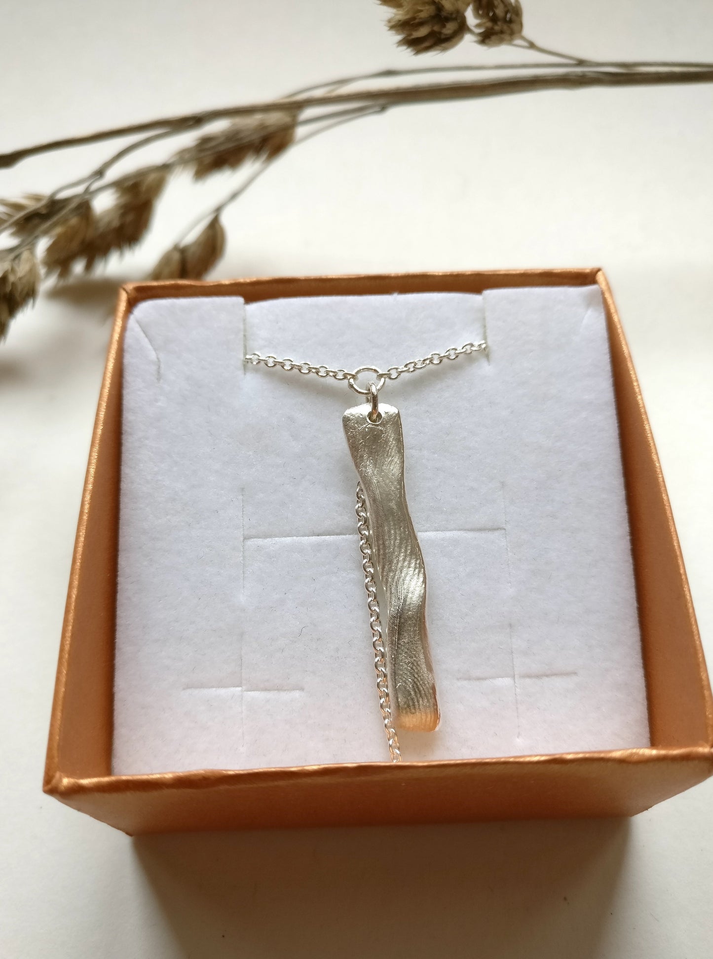 Ketting in zilver met vingerafdrukken: op maat gemaakt