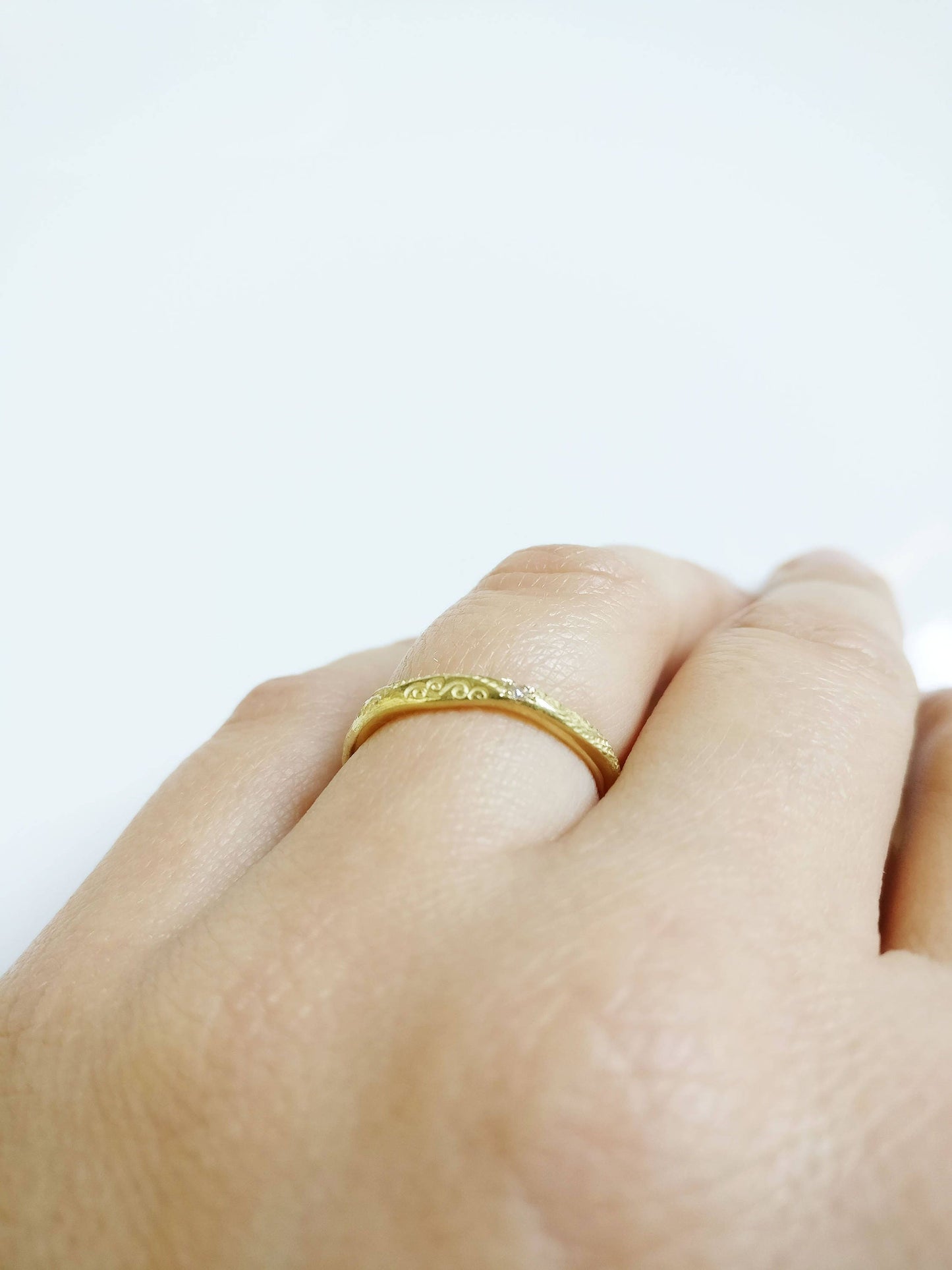 Geel gouden trouwring met patroon