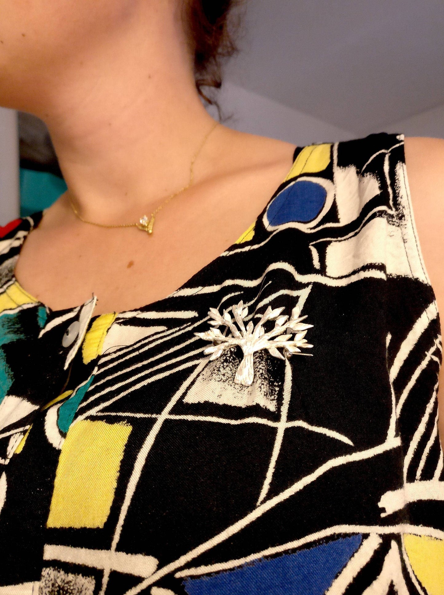 Broche in zilver: op maat gemaakt.
