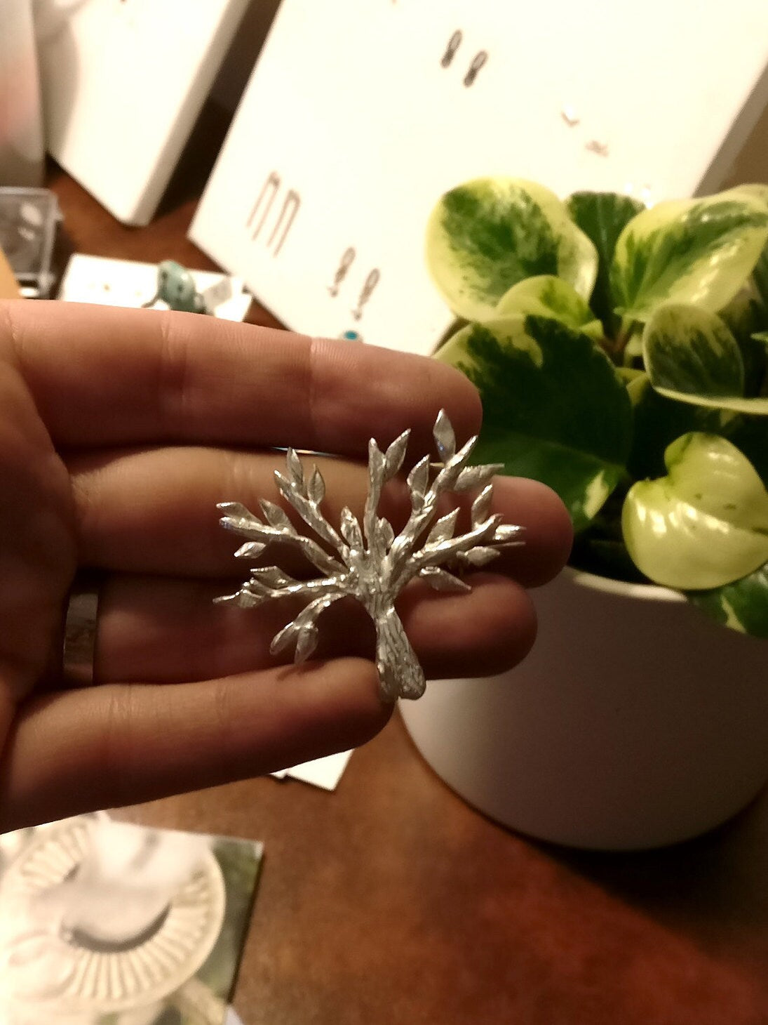 Broche in zilver: op maat gemaakt.