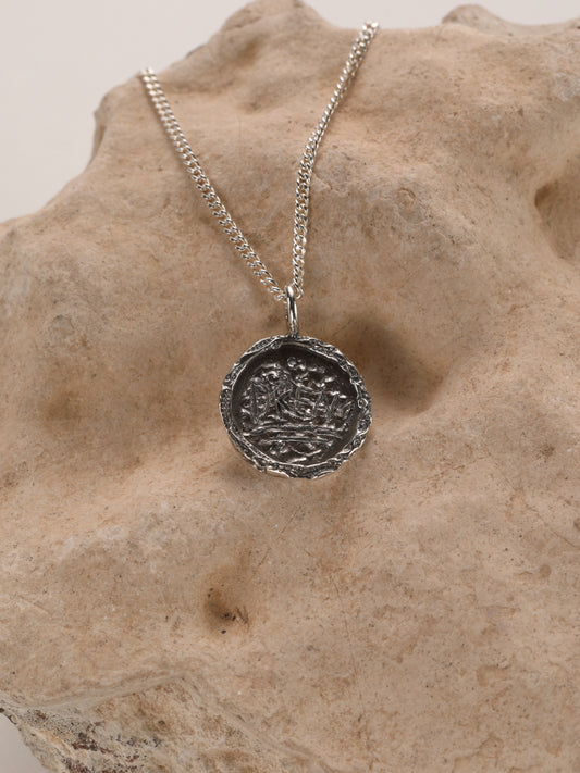 Zilveren ketting en ronde hanger: Dream