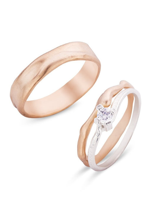 Trouwringen in 18k rosé goud en wit goud met diamant: Charles en Diana.