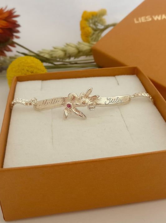 Armband in zilver met topaas en robijn: op maat gemaakt.